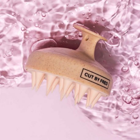 Brosse stimulante pour le cuir chevelu
